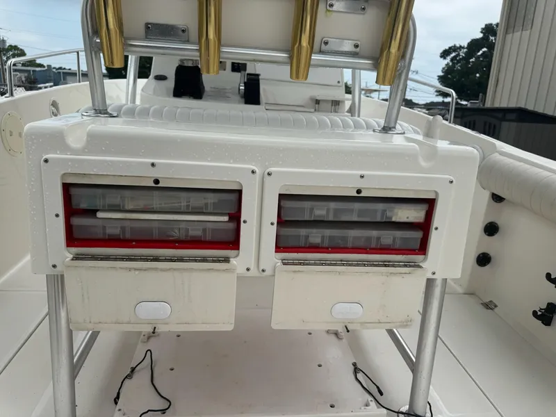 Slide: The Image of 2004 Robalo R230 Center Console boat with tackle storage and rod holders. - 15