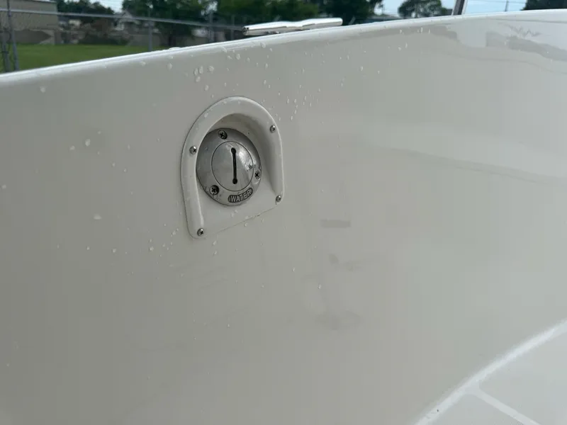 Slide: The Image of Water inlet on 2004 Robalo R230 Center Console boat, close-up view. - 27
