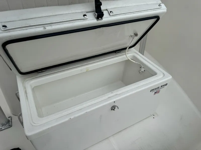Slide: The Image of Open storage compartment on 2004 Robalo R230 Center Console boat. - 33