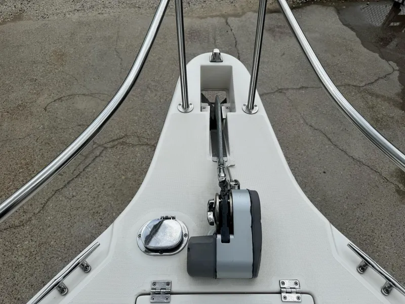 Slide: The Image of Bow of 2004 Robalo R230 Center Console with anchor and railing. - 36