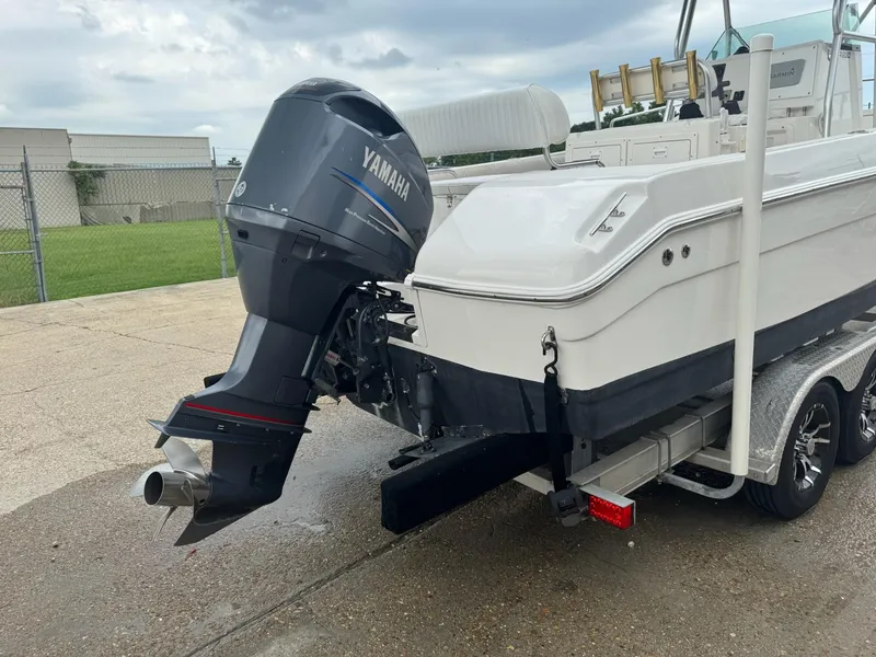 Slide: The Image of 2004 Robalo R230 Center Console boat with Yamaha outboard motor on a trailer. - 39