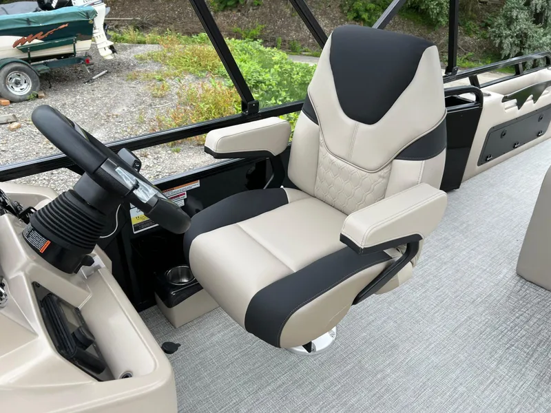 Slide: The Image of Captain's chair in 2026 Tahoe Pontoon 2385 VRB boat, featuring sleek design and comfortable seating. - 10