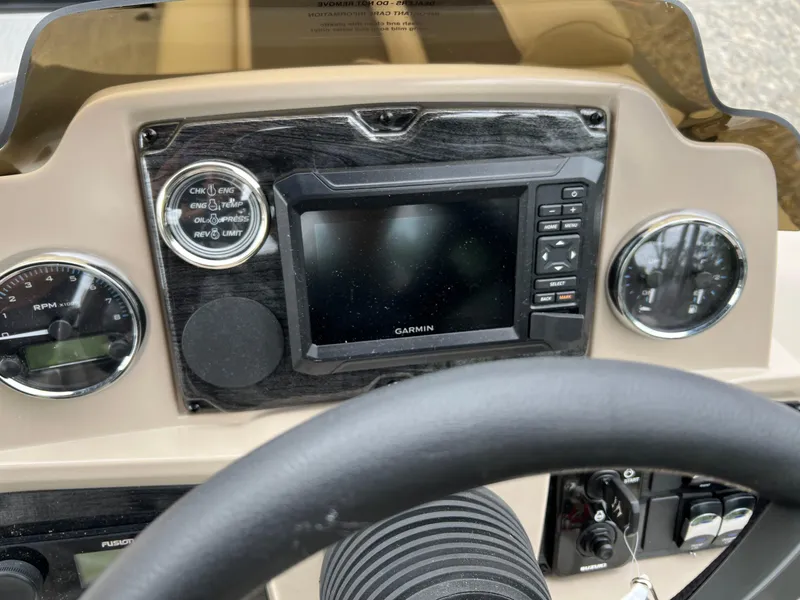 Slide: The Image of Dashboard of 2026 Tahoe Pontoon 2385 VRB with Garmin navigation system and gauges. - 13