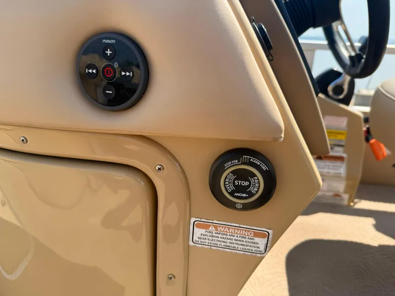 Slide: The Image of 2009 Bennington 2275QXi boat dashboard with control panel and warning label. - 16