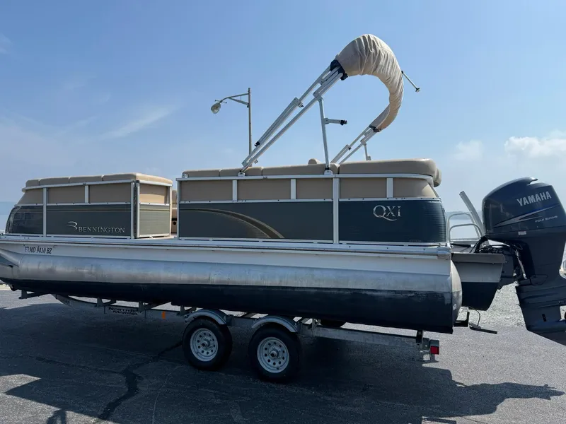 Slide: The Image of 2009 Bennington 2275QXi pontoon boat on trailer with Yamaha outboard motor. - 3