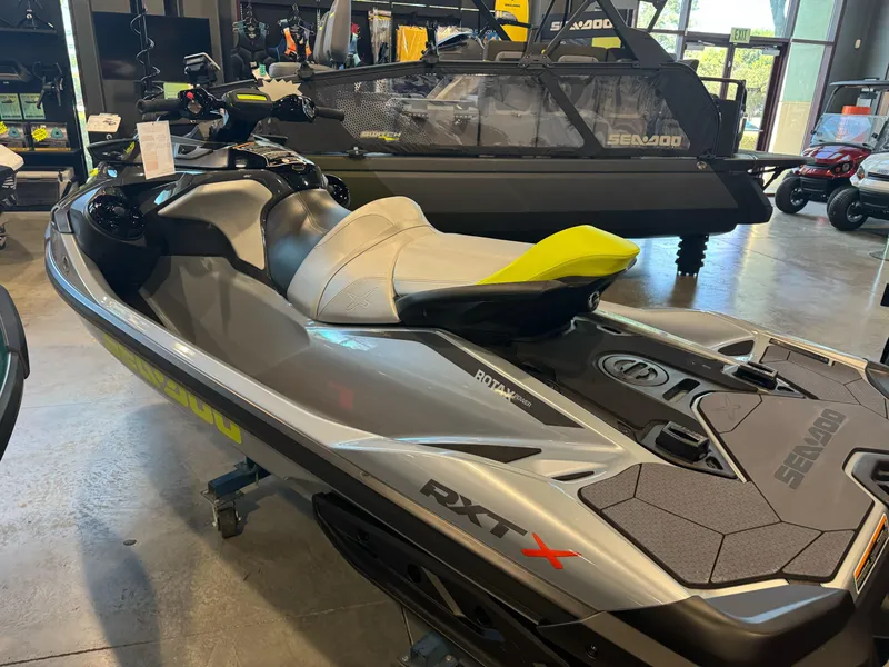 Slide: The Image of 2025 Sea-Doo RXT-X 325 jet ski in showroom, featuring sleek design and advanced features. - 7