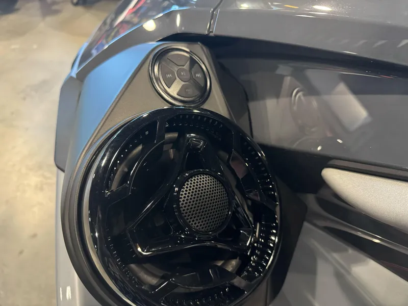Slide: The Image of Close-up of 2025 Sea-Doo RXT-X 325 speaker and control panel. - 9
