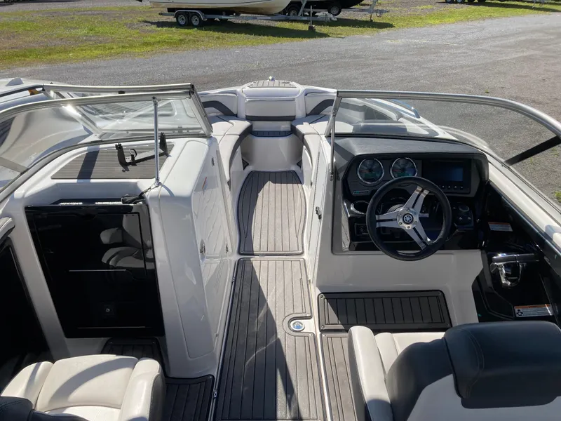 Slide: The Image of 2017 Yamaha Boats 242 Limited S E-Series interior with steering wheel and seating. - 14