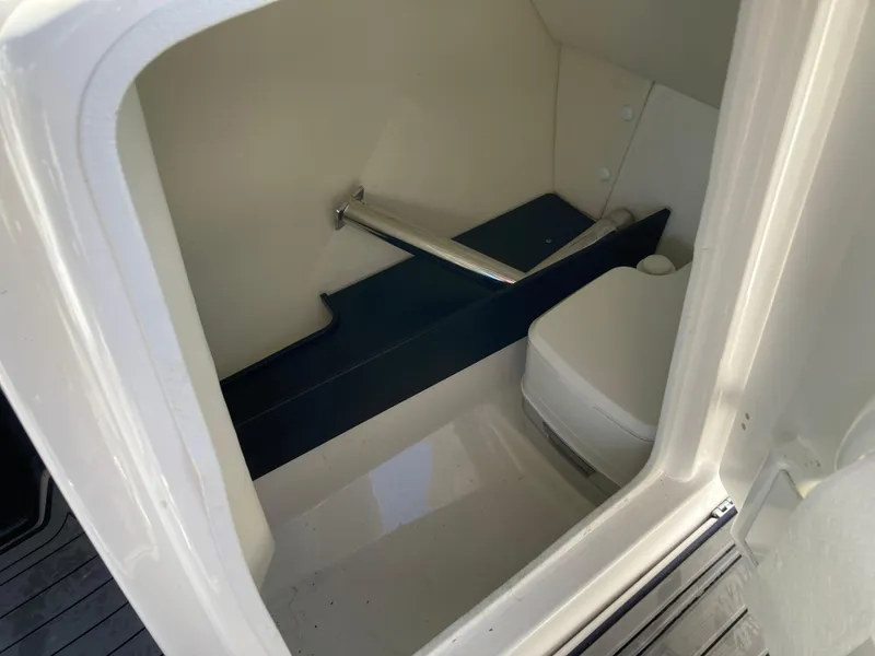 Slide: The Image of 2017 Yamaha Boats 242 Limited S E-Series interior cabin with compact toilet. - 22