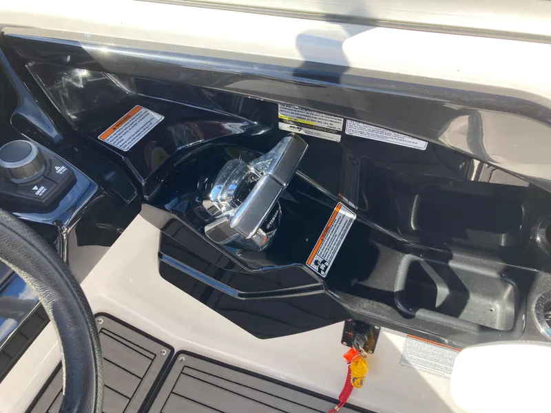 Slide: The Image of Control panel of 2017 Yamaha Boats 242 Limited S E-Series with throttle and warning labels. - 24