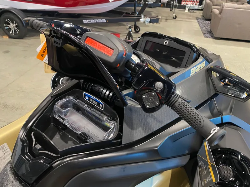 Slide: The Image of 2025 Sea-Doo RXT-X 325 handlebar and dashboard close-up in showroom. - 11