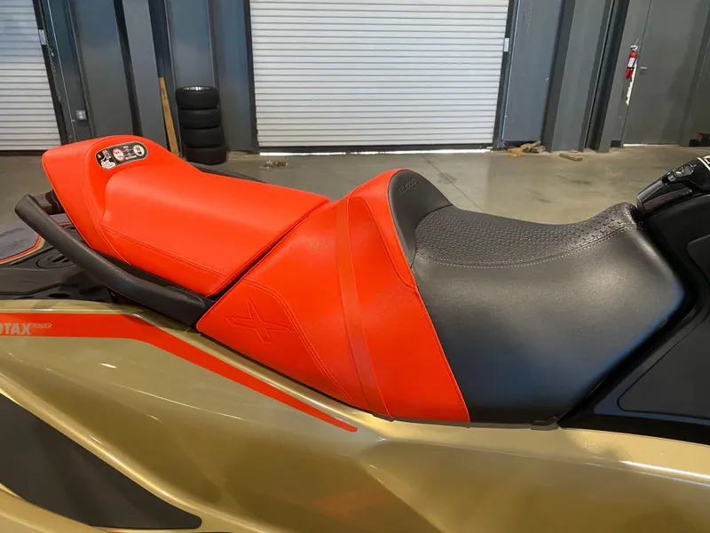 Slide: The Image of 2025 Sea-Doo RXT-X 325 jet ski seat, featuring vibrant red and black design. - 8
