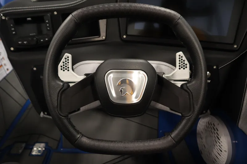 Slide: The Image of Steering wheel of 2025 Centurion Fe23 boat, featuring modern design and controls. - 19