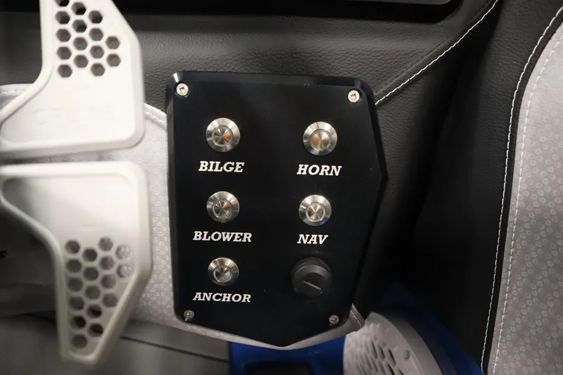 Slide: The Image of Control panel of a 2025 Centurion Fe23 boat with labeled switches. - 23