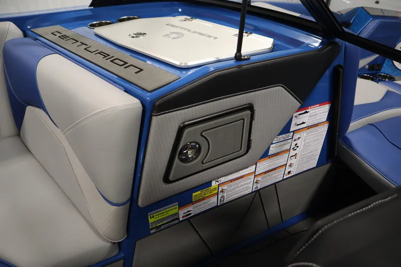 Slide: The Image of Interior of 2025 Centurion Fe23 boat with blue and gray seating and control panel. - 29