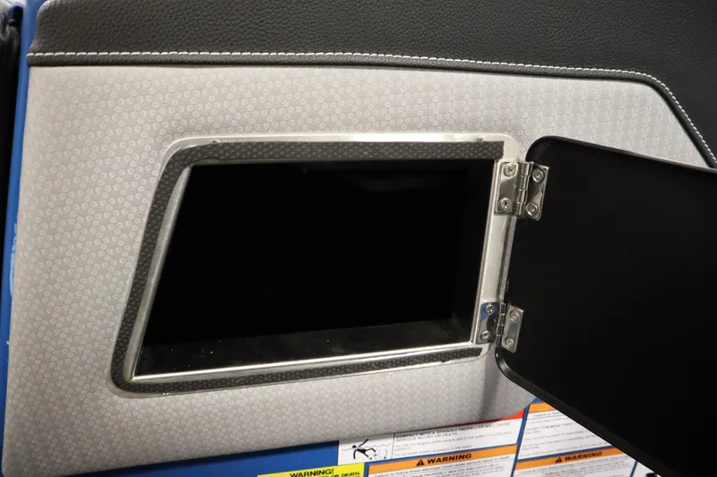 Slide: The Image of Open storage compartment in 2025 Centurion Fe23 boat interior. - 30