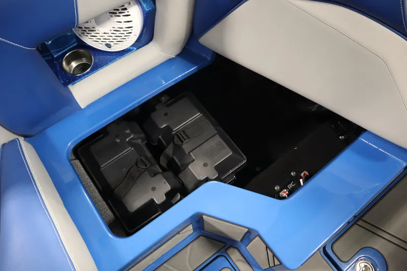 Slide: The Image of 2025 Centurion Fe23 boat interior with battery compartment and speaker. - 38