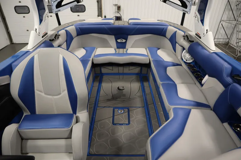 Slide: The Image of Luxurious interior of 2025 Centurion Fe23 boat with blue and gray seating. - 42