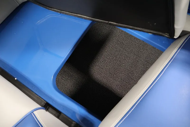 Slide: The Image of Interior view of 2025 Centurion Fe23 boat, featuring blue and black seating area. - 44
