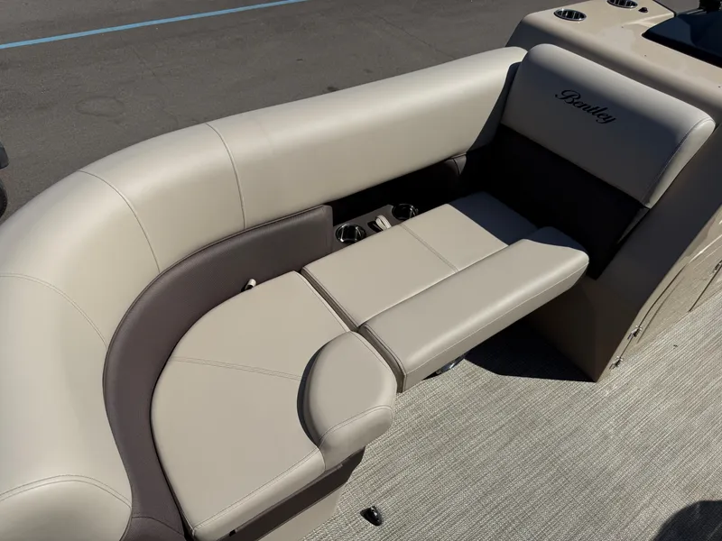 Slide: The Image of 2026 Bentley Pontoons Elite 220 Admiral, luxurious seating with beige upholstery. - 10