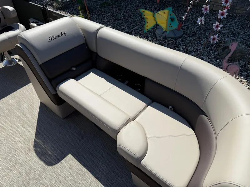 Slide: The Image of 2026 Bentley Pontoons Elite 220 Admiral interior seating with elegant beige upholstery. - 12
