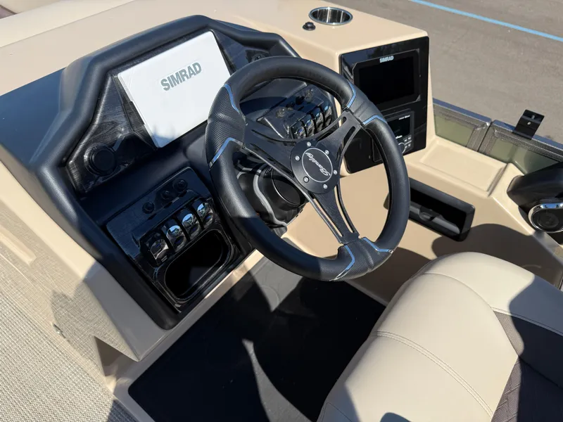 Slide: The Image of 2026 Bentley Pontoons Elite 220 Admiral dashboard with steering wheel and Simrad display. - 19