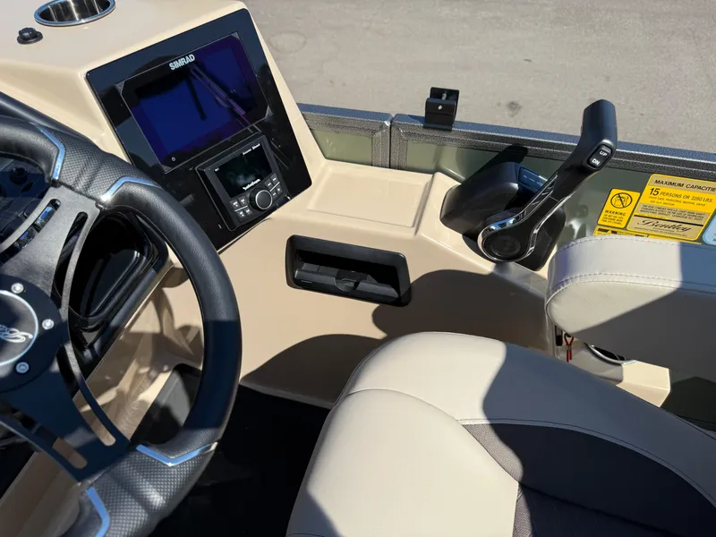Slide: The Image of Interior of 2026 Bentley Pontoons Elite 220 Admiral, featuring steering wheel and control panel. - 20