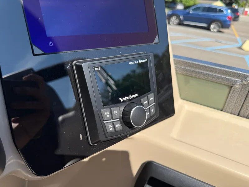 Slide: The Image of 2026 Bentley Pontoons Elite 220 Admiral dashboard with Rockford Fosgate audio system. - 22