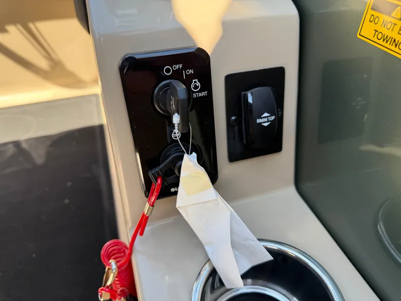 Slide: The Image of Control panel of 2026 Bentley Pontoons Elite 220 Admiral with ignition and Bimini top switch. - 27