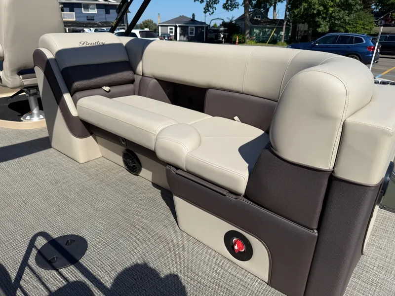 Slide: The Image of 2026 Bentley Pontoons Elite 220 Admiral interior seating, featuring luxurious beige and brown upholstery. - 28