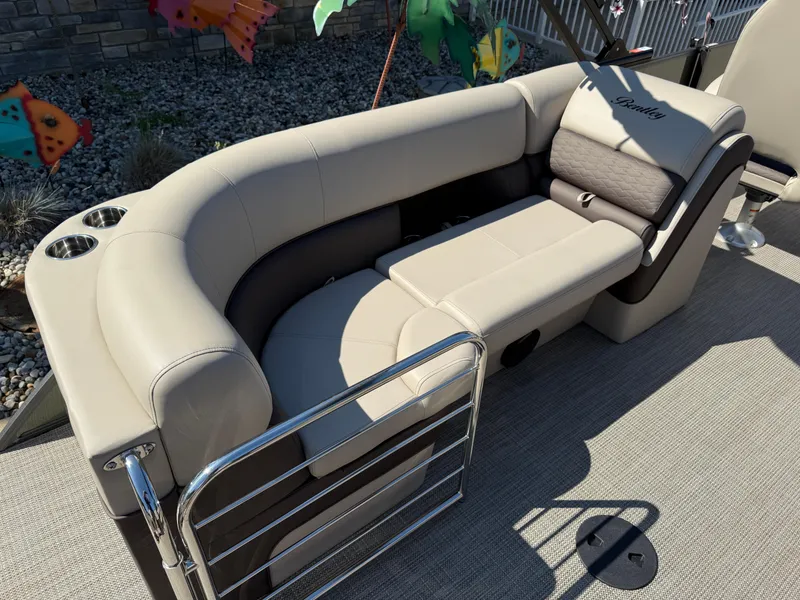 Slide: The Image of 2026 Bentley Pontoons Elite 220 Admiral interior with luxurious seating and cup holders. - 29