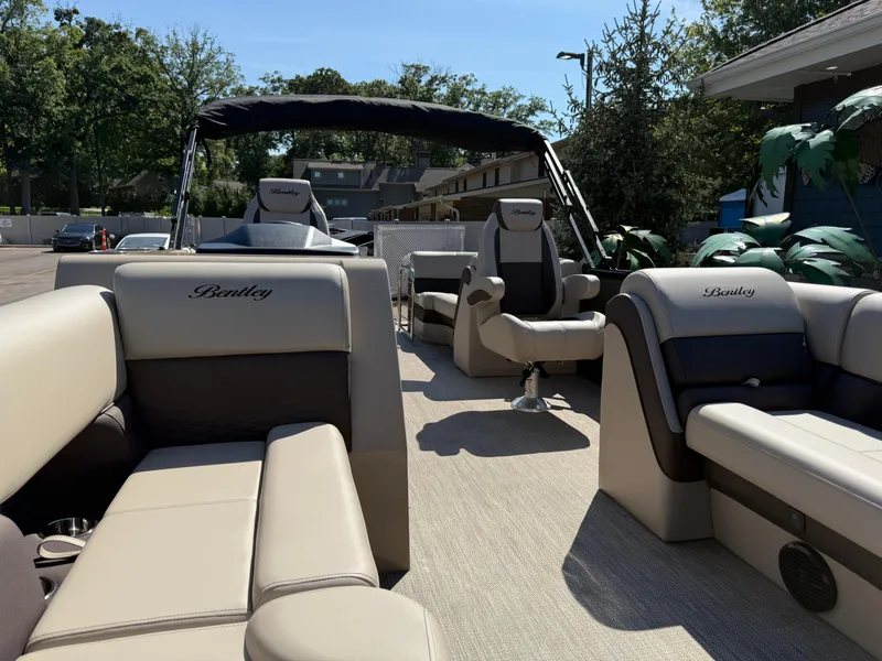 Slide: The Image of 2026 Bentley Pontoons Elite 220 Admiral interior with luxurious seating and modern design. - 9