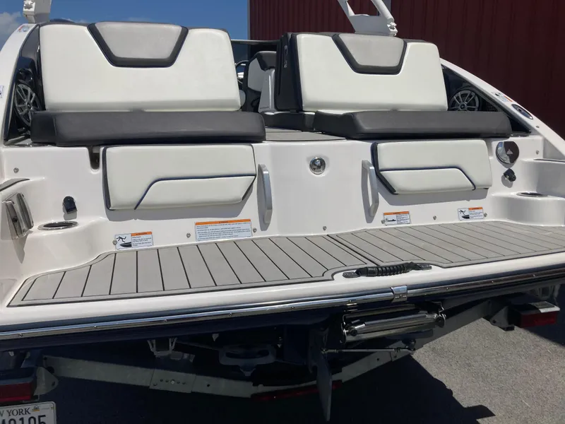 Slide: The Image of 2021 Yamaha Boats 252S swim platform with cushioned seating and sleek design. - 11