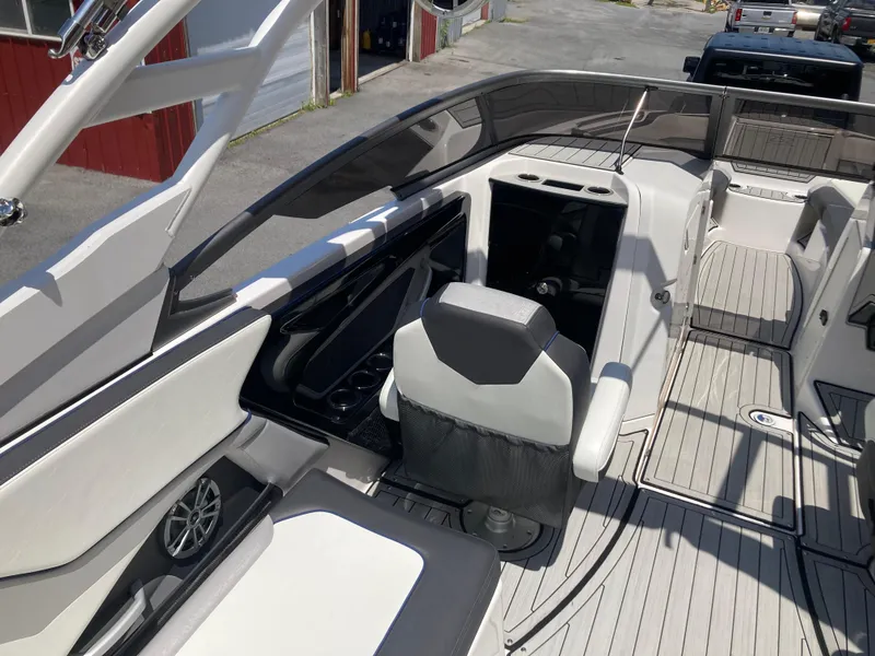 Slide: The Image of 2021 Yamaha Boats 252S interior with seating and sleek design. - 12