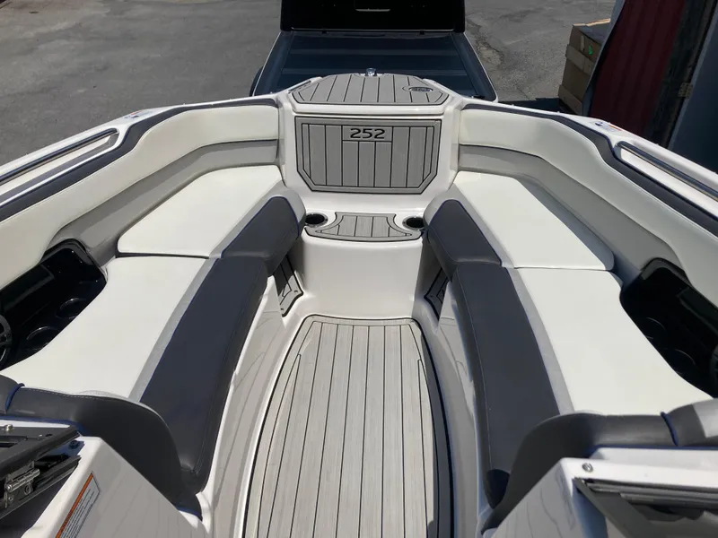 Slide: The Image of 2021 Yamaha Boats 252S interior with sleek seating and modern design. - 17