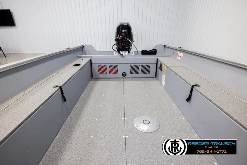 Slide: The Image of 2026 Lund 1600 Fury Tiller boat interior with motor, showcased at Reeder-Trausch Marine. - 12