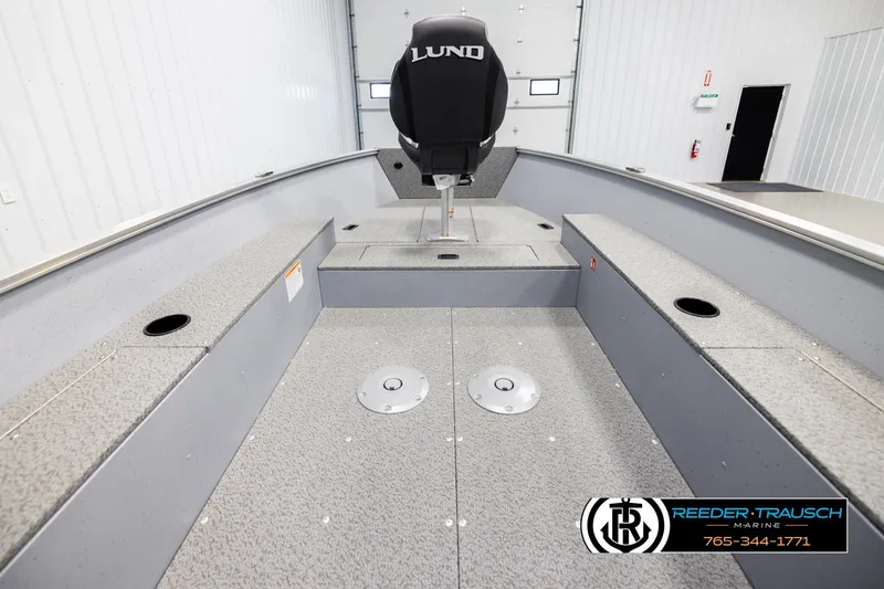 Slide: The Image of 2026 Lund 1600 Fury Tiller boat interior with seating and storage compartments. - 15