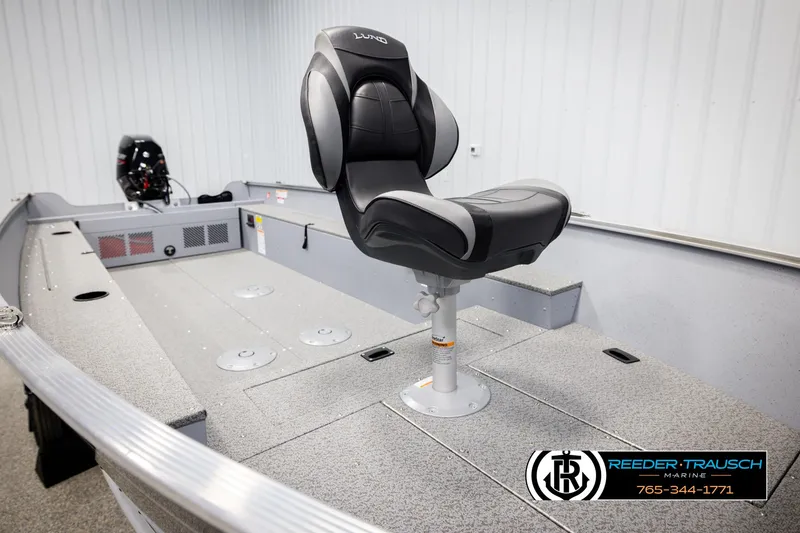 Slide: The Image of 2026 Lund 1600 Fury Tiller boat interior with seating and motor, displayed at Reeder-Trausch Marine. - 22
