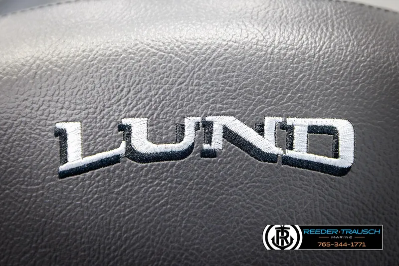 Slide: The Image of Lund 1600 Fury Tiller 2026 logo on textured surface, Reeder-Trausch Marine contact. - 27