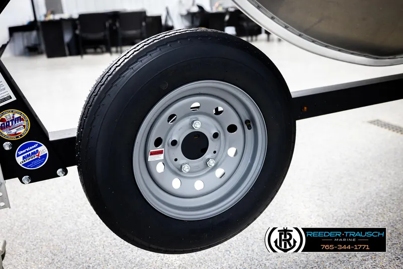 Slide: The Image of Trailer wheel of 2026 Lund 1600 Fury Tiller, displayed at Reeder-Trausch Marine. - 37