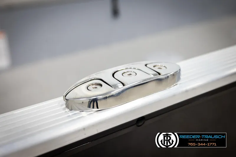 Slide: The Image of Close-up of a 2026 Lund 1600 Fury Tiller boat's sleek chrome hardware. - 39