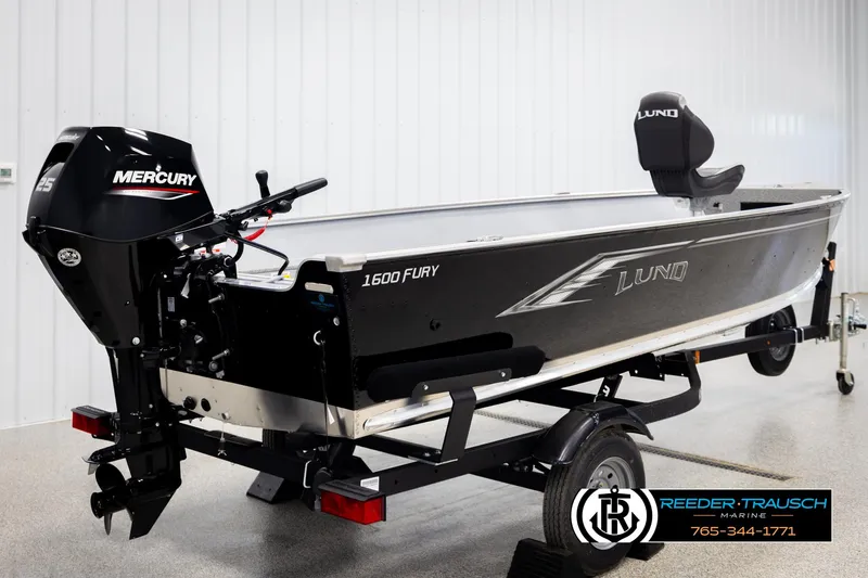 Slide: The Image of 2026 Lund 1600 Fury Tiller boat with Mercury engine on trailer in showroom. - 4