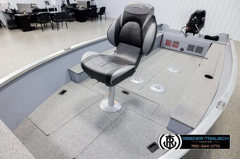 Slide: The Image of 2026 Lund 1600 Fury Tiller boat interior with seating and storage compartments. - 8