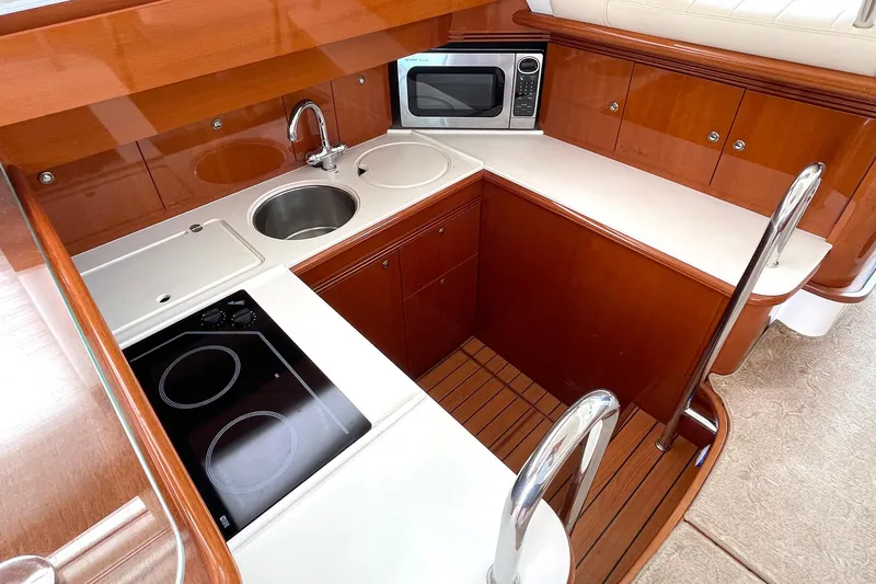 Slide: The Image of Luxurious kitchen area in 2007 Prestige 46 Flybridge yacht with modern amenities. - 10