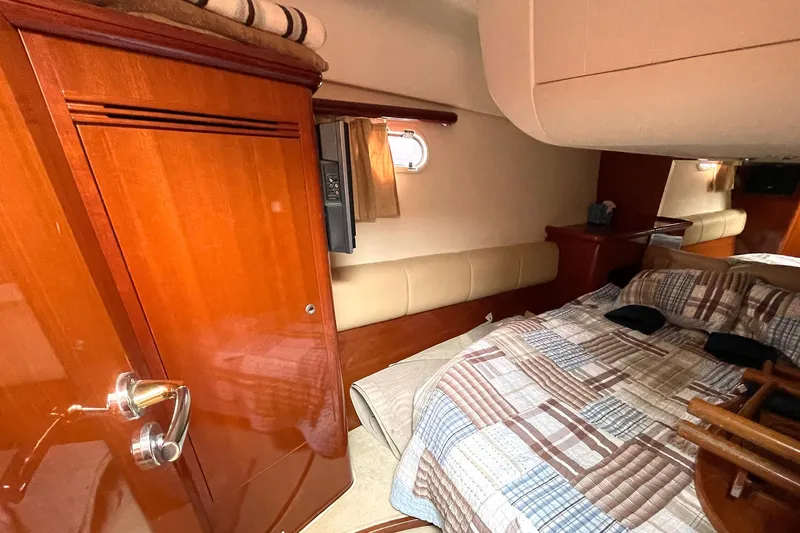 Slide: The Image of Luxurious cabin interior of 2007 Prestige 46 Flybridge yacht with cozy bedding. - 17