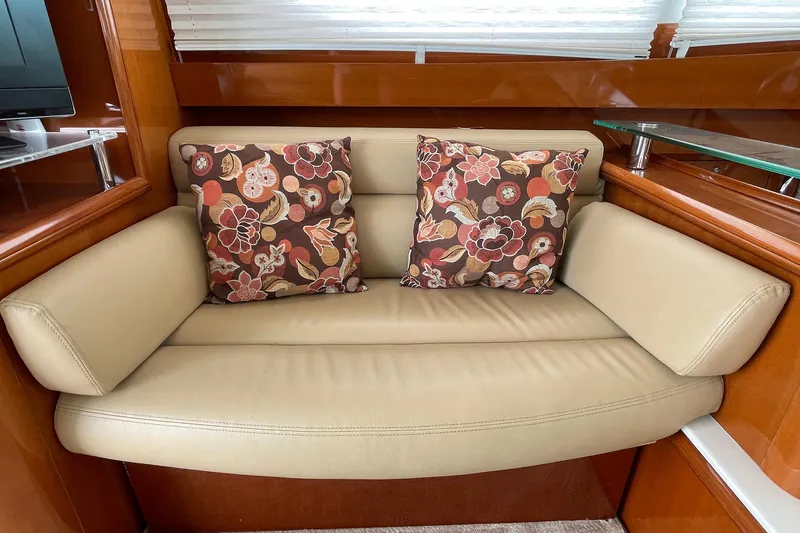 Slide: The Image of Beige leather sofa with floral cushions in 2007 Prestige 46 Flybridge yacht interior. - 8