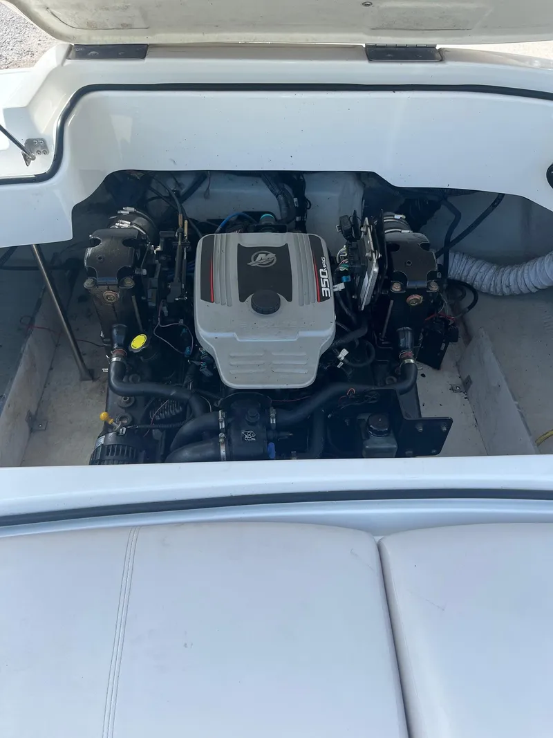 Slide: The Image of Engine compartment of a 2009 Cobalt 210 boat, featuring a MerCruiser 350 engine. - 3