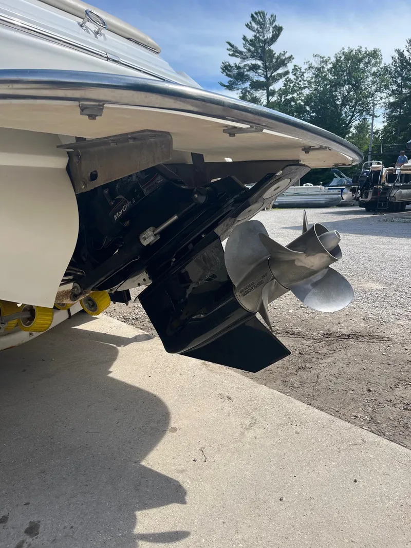 Slide: The Image of Rear view of a 2009 Cobalt 210 boat with visible propeller and outdrive. - 8