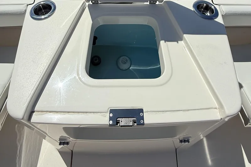 Slide: The Image of 2024 Pathfinder 2700 Open boat livewell with cup holders and latch. - 18