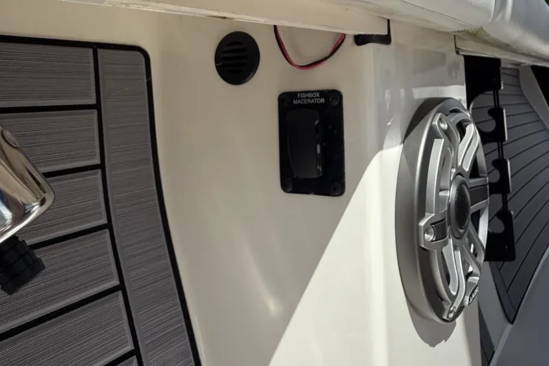Slide: The Image of 2024 Pathfinder 2700 Open boat interior with speaker and fishbox macerator switch. - 20